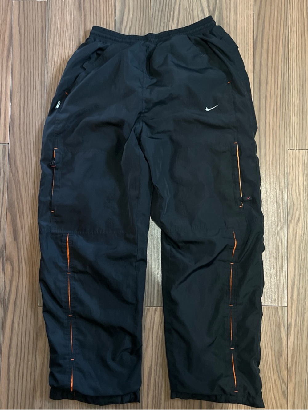 Nike Men's Black Track Pants with Orange Trim